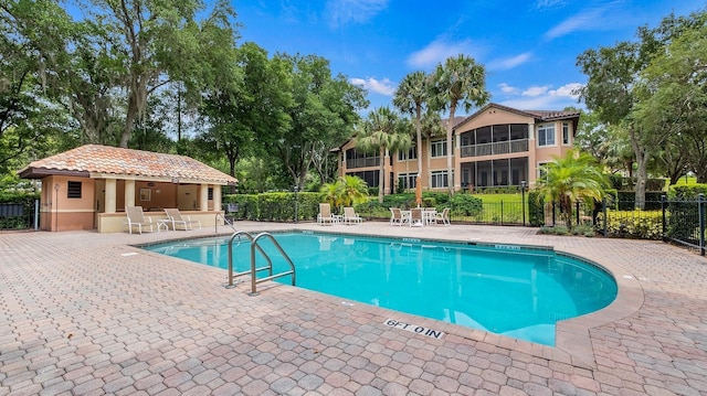 view of swimming pool with a patio area