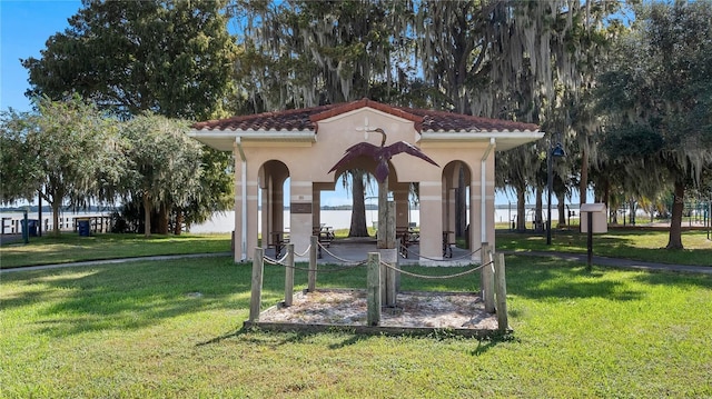 view of community featuring a lawn and a gazebo