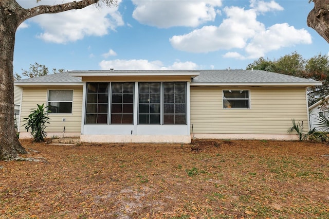 back of house with a sunroom