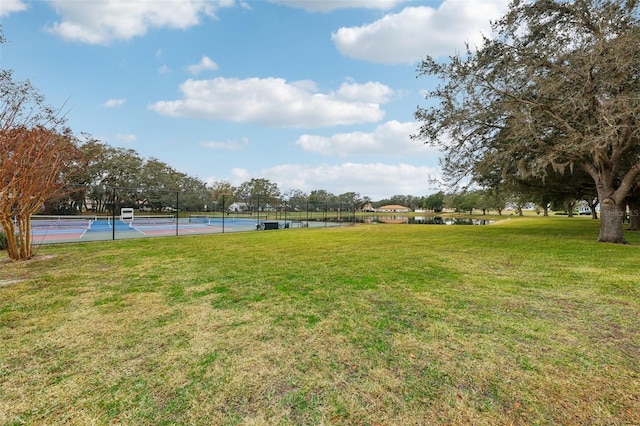 view of yard with tennis court