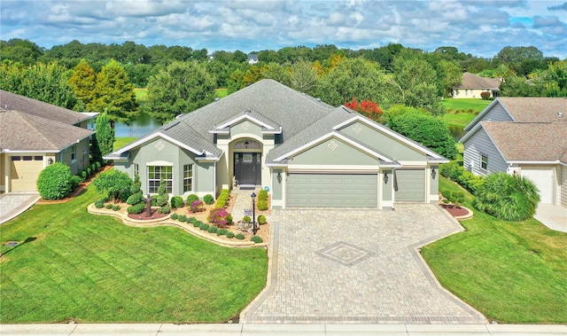 view of front facade with a garage and a front lawn