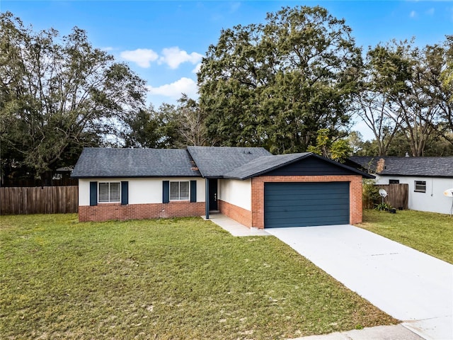 ranch-style house with a garage and a front yard