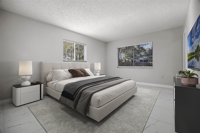 bedroom featuring a textured ceiling