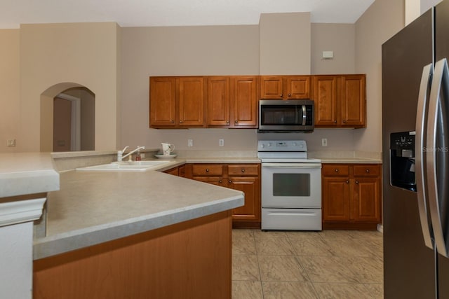 kitchen with sink and appliances with stainless steel finishes