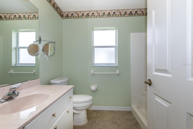 bathroom featuring toilet, a textured ceiling, a shower, tile patterned floors, and vanity