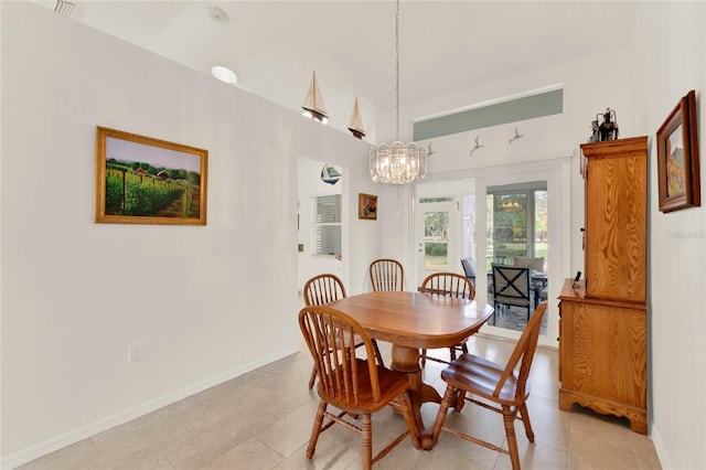 tiled dining room featuring vaulted ceiling and an inviting chandelier