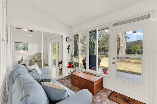 sunroom / solarium with vaulted ceiling