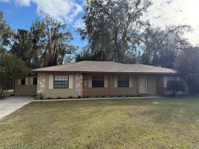 single story home with a front yard and a porch