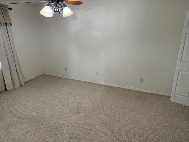 unfurnished room with ceiling fan and light colored carpet