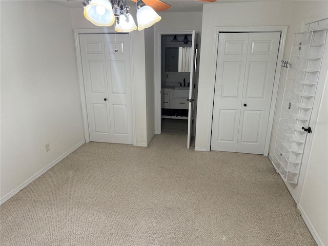 unfurnished bedroom featuring ceiling fan and light carpet