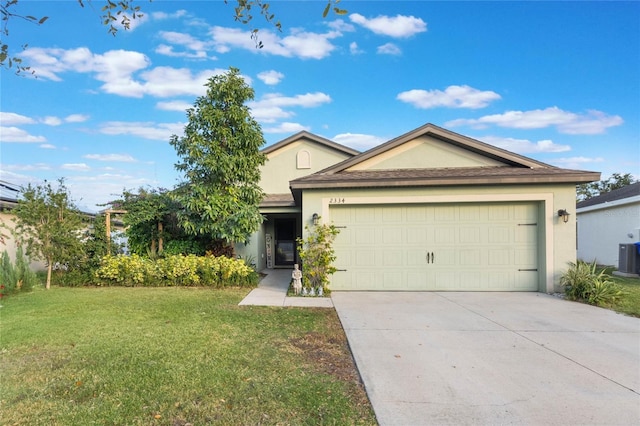 view of front facade with a garage and a front yard