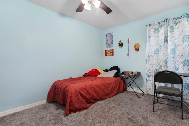 bedroom with ceiling fan and carpet flooring