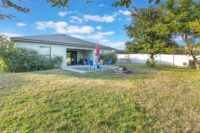 view of yard with a patio area and an outdoor fire pit