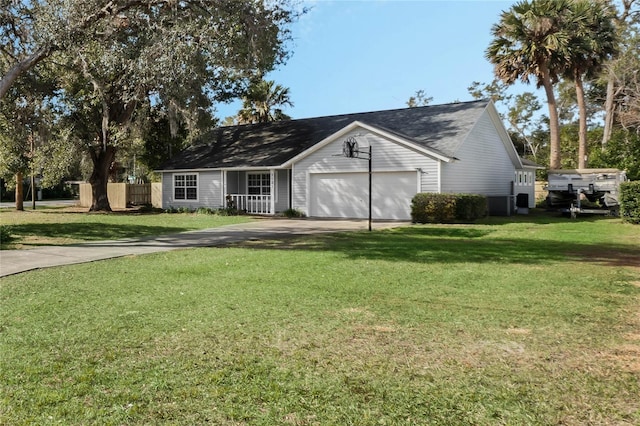 ranch-style home featuring a garage and a front lawn