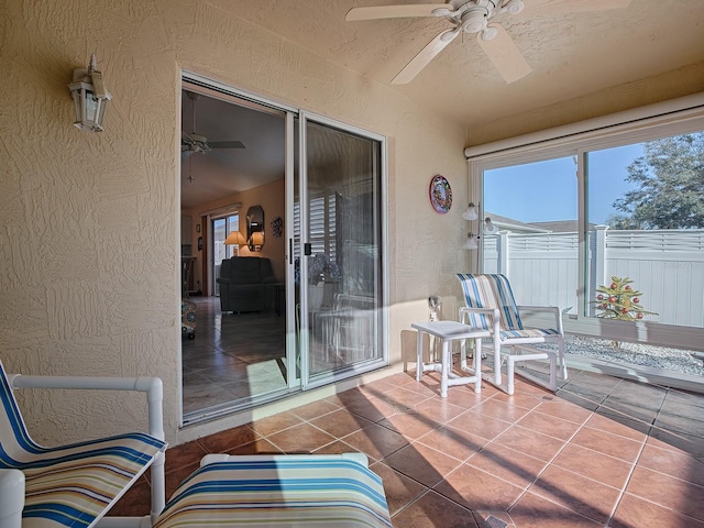 sunroom / solarium with ceiling fan