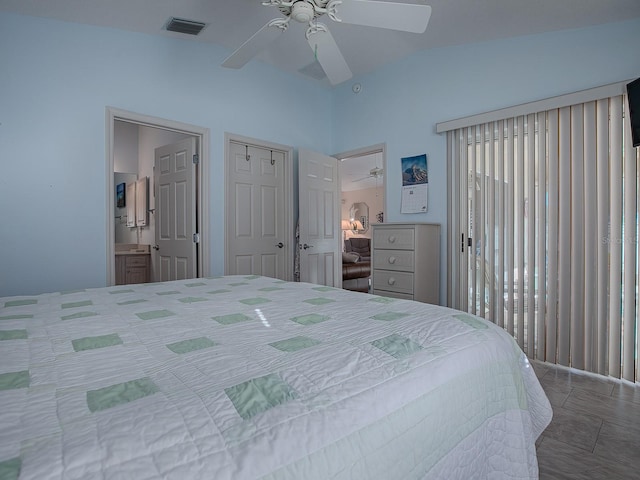 bedroom with vaulted ceiling, ceiling fan, and ensuite bathroom