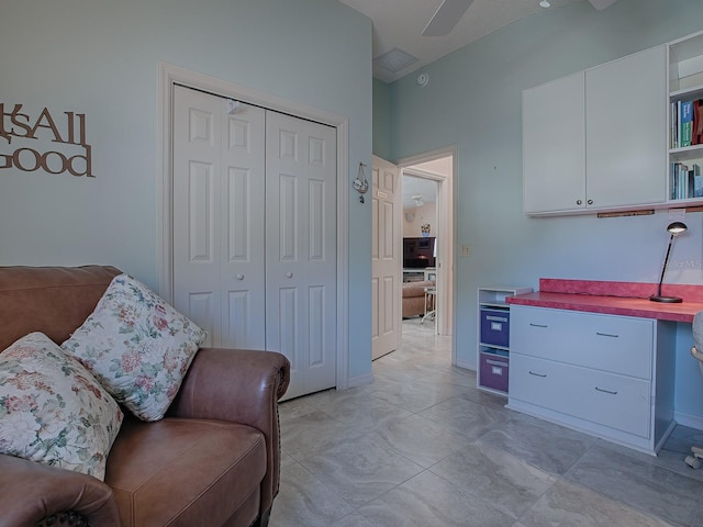 living area with ceiling fan