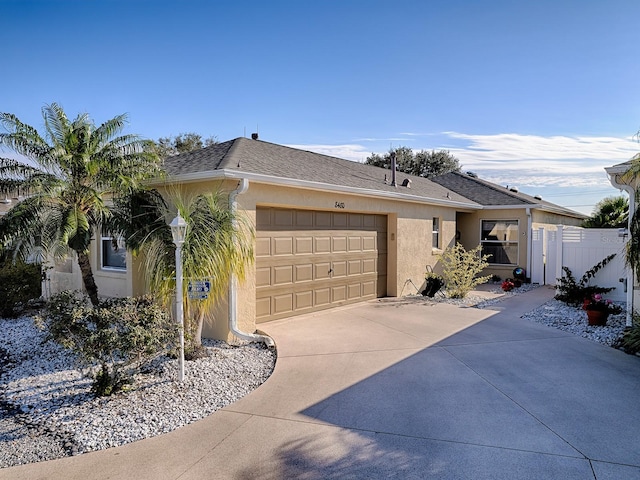 single story home featuring a garage