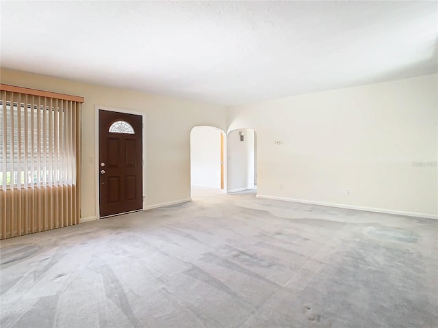 foyer with light colored carpet