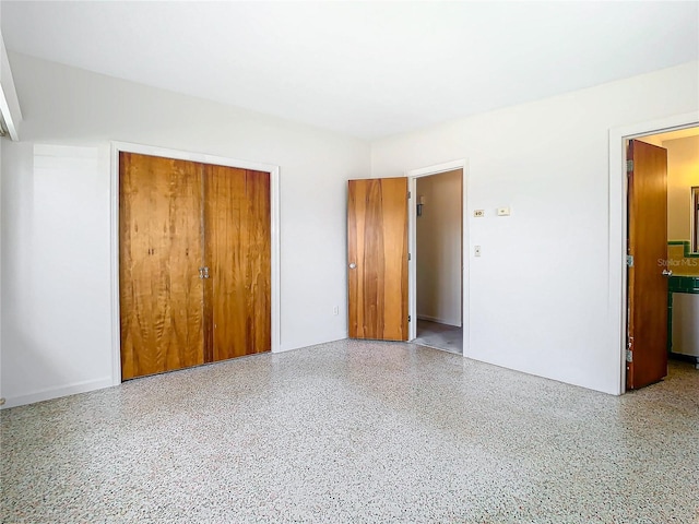 unfurnished bedroom with a closet