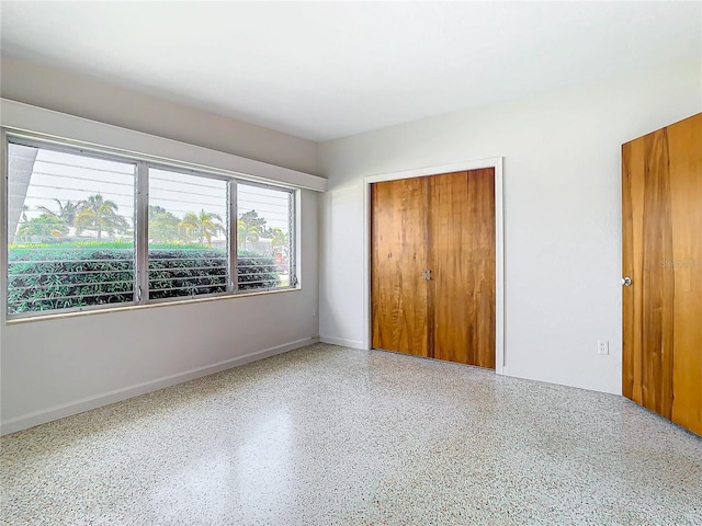 unfurnished bedroom with a closet