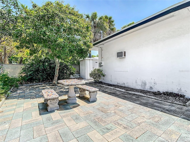 view of patio featuring a shed