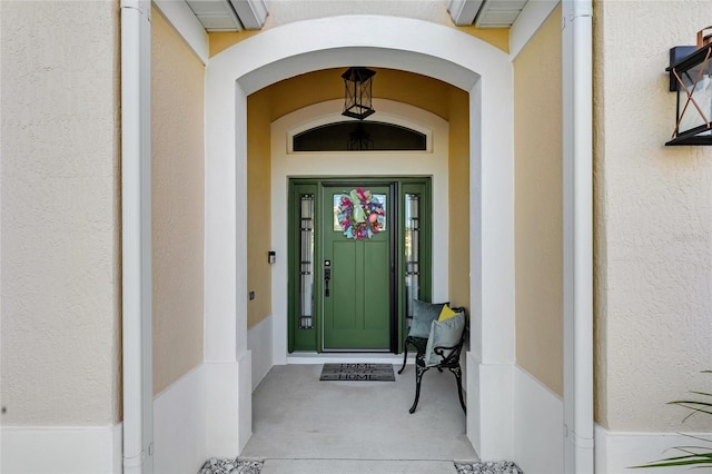 5857 Mackenzie Ave, The Villages, FL 32163 - view of exterior entry featuring stucco siding