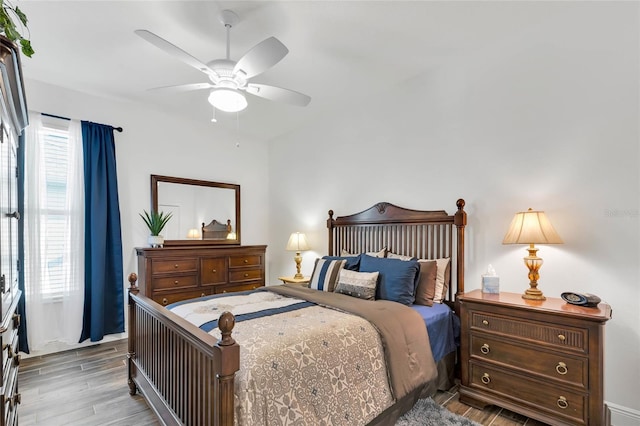 5857 Mackenzie Ave, The Villages, FL 32163 - bedroom with wood finished floors and ceiling fan