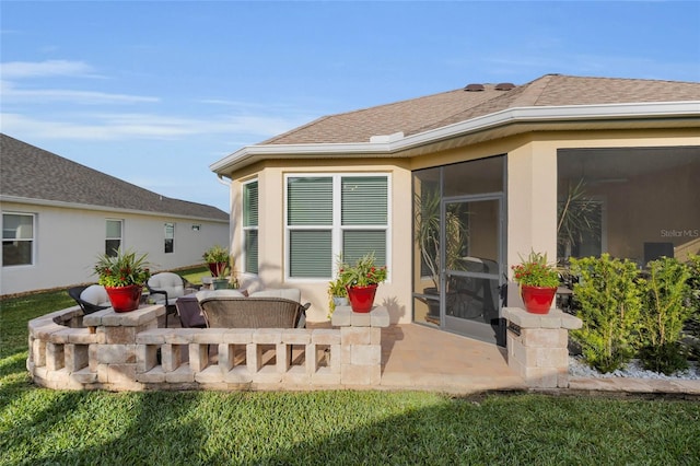5857 Mackenzie Ave, The Villages, FL 32163 - rear view of house with a shingled roof, stucco siding, and a patio