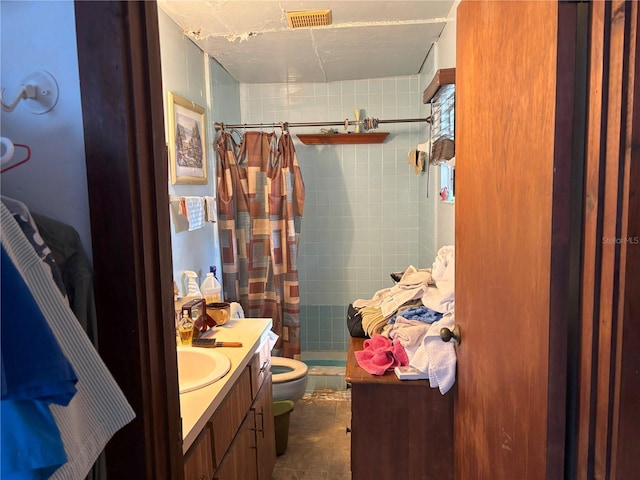 bathroom with tile patterned flooring, toilet, vanity, and a shower with shower curtain