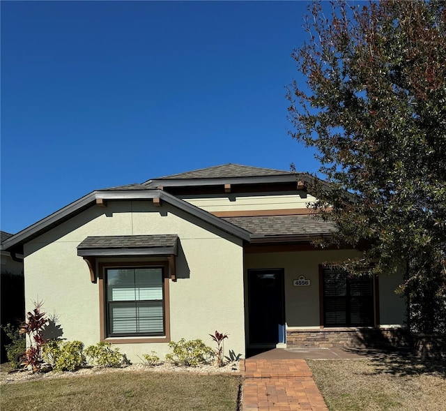 view of front of home with a front lawn