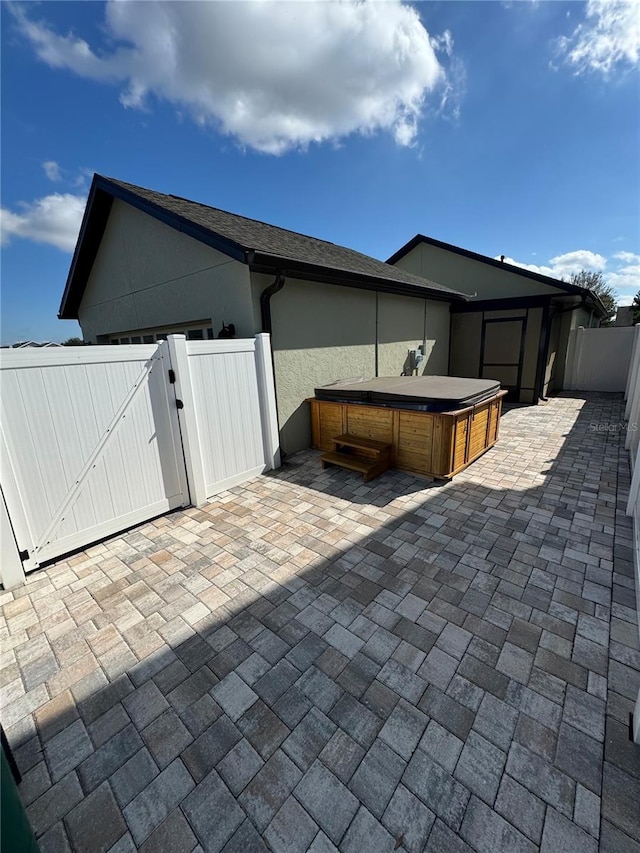 view of patio featuring a hot tub