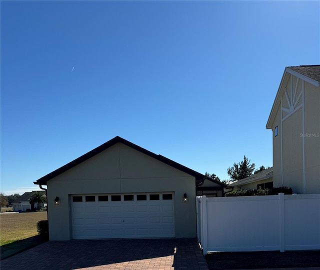 view of side of property featuring a garage