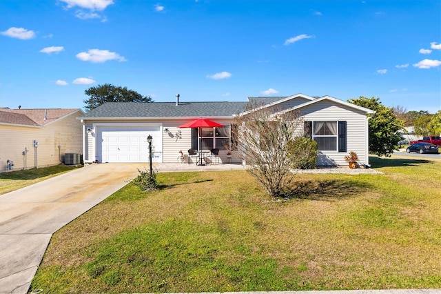 ranch-style house featuring a garage, cooling unit, and a front lawn