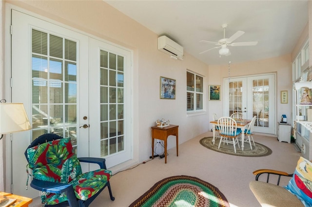 sunroom with ceiling fan, french doors, and a wall mounted air conditioner