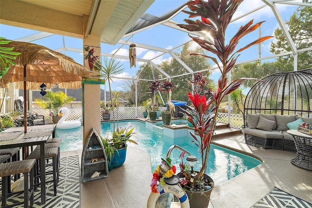 view of pool with a lanai, an outdoor living space, a patio area, and pool water feature