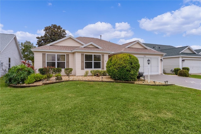 single story home with a front yard and a garage