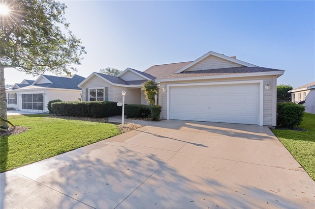 single story home with a garage and a front lawn