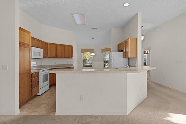 kitchen with decorative light fixtures, vaulted ceiling, light colored carpet, a kitchen island, and white appliances