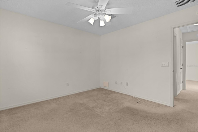 carpeted empty room with a textured ceiling and ceiling fan