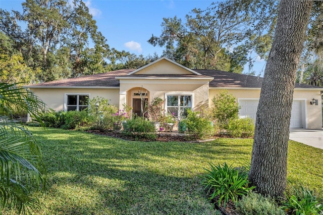 ranch-style home featuring a garage and a front yard