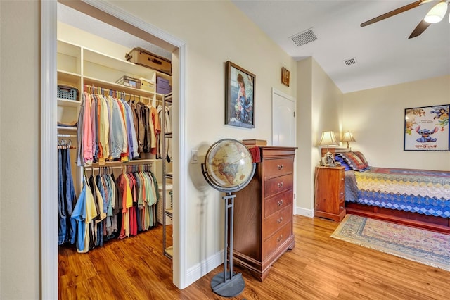 bedroom featuring a closet, ceiling fan, and light hardwood / wood-style floors