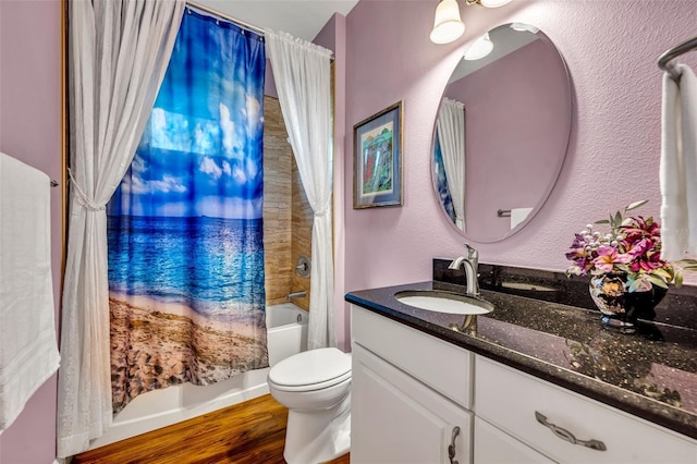 full bathroom featuring vanity, toilet, shower / bath combo with shower curtain, and wood-type flooring