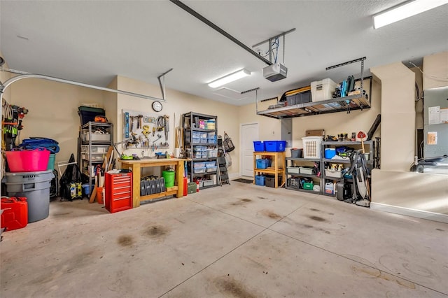 garage featuring a workshop area and a garage door opener