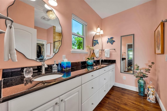 bathroom featuring vanity and hardwood / wood-style flooring