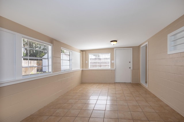 tiled empty room with plenty of natural light