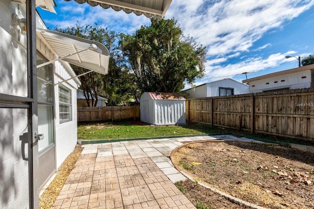 view of yard with a patio area and a shed