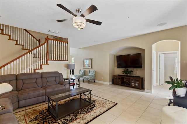 tiled living room featuring ceiling fan