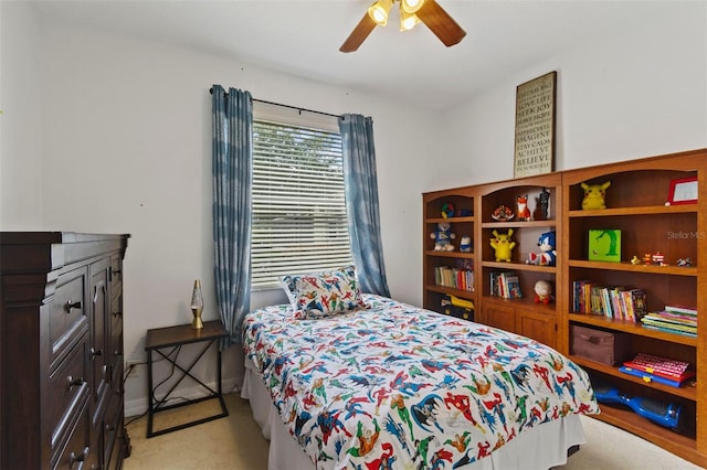 bedroom with ceiling fan and light colored carpet