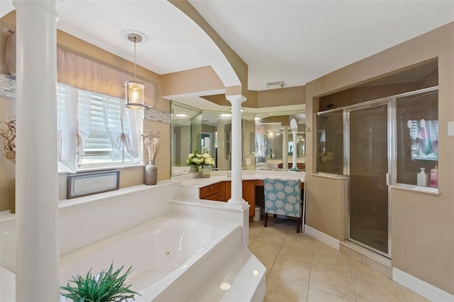 bathroom with ornate columns, tile patterned flooring, separate shower and tub, and vanity